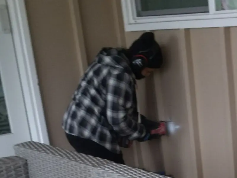 Professional electrician installing an exterior outlet in Brookfield